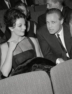 Joan Collins and Marlon Brando