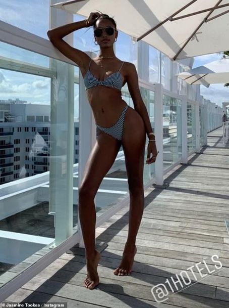 Jasmine Tookes shows off her Angel figure in a tiny bikini as she poses up a storm in Miami