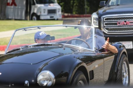Mila Kunis – Out in Los Angeles riding his classic ford convertible