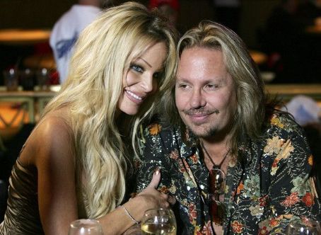 Motley Crue singer Vince Neil and his wife Lia Neil pause as they are ...