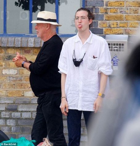 Pink Floyd's David Gilmour heads out for lunch with his wife Polly and son Charlie