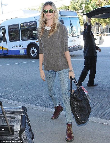 Behati Prinsloo dresses down for a flight ahead of Victoria's Secret Fashion Show... after spending Thanksgiving with Adam Levine