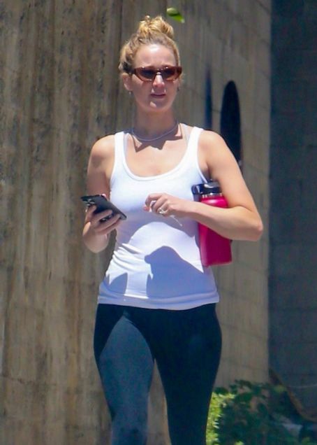 Jennifer Lawrence sports a white top and black leggings as she