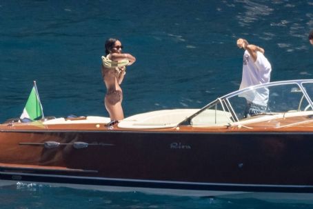 Laura Harrier – In a bikini on a boat with new beau Sam Jarou in Positano