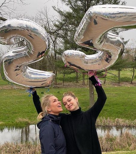 Was Gigi Hadid's 25th birthday also a gender reveal party? Eagle-eyed fans spot pink and blue balloon strings and 'Hello Little One' gift bags amid news she's 'five months pregnant'