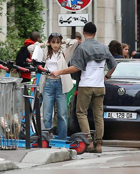 Lily Collins – With new boyfriend Charlie McDowell go for a ride in scooter in Paris