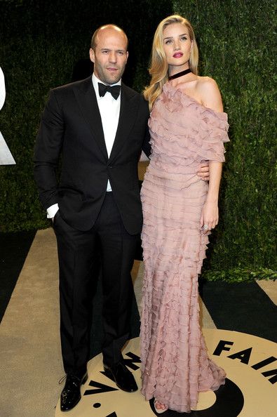 Actor Jason Statham and actress Rosie Huntington-Whiteley arrive at the 2013 Vanity Fair Oscar Party hosted by Graydon Carter at Sunset Tower on February 24, 2013 in West Hollywood, California