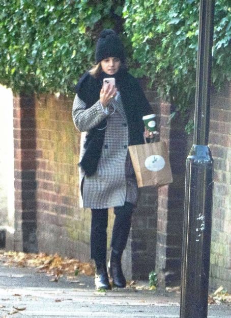 Emma Watson – Takes a Facetime call while out for a walk in London