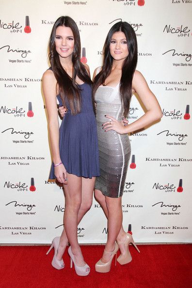 Kendall Jenner and Kylie Jenner attend the grand opening of 
