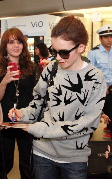 Lily Collins and Jamie Campbell Bower arriving in Berlin (August 20