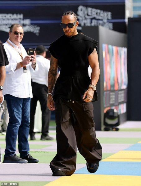 Lewis Hamilton shows off his edgy sense of style in a quirky black jumper and cargo trousers ahead of the Saudi Arabia Grand Prix