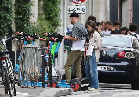 Lily Collins – With new boyfriend Charlie McDowell go for a ride in scooter in Paris