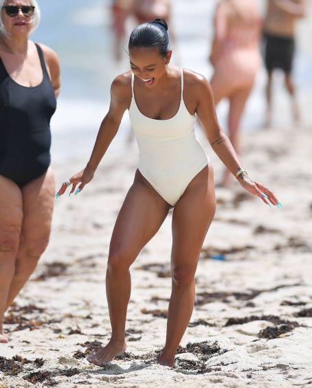 Karrueche Tran – In a white swimsuit in Miami