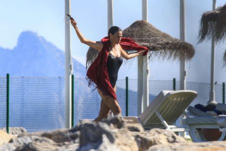 Ines Sastre in Black Swimsuit on the beach in Sotogrande | Inés Sastre