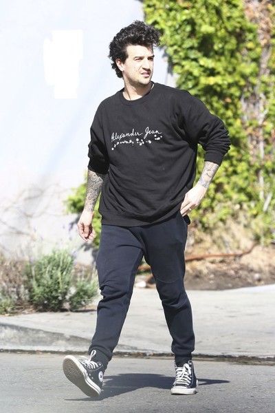 Mark Ballas meets up with a friend in West Hollywood, California on March 22, 2017