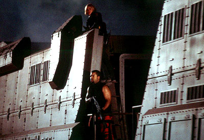Clea DuVall as Bashira Kincaid and Ice Cube as James 'Desolation' Williams hunt for Martian ghosts in Screen Gems' John Carpenter's Ghosts of Mars - 2001