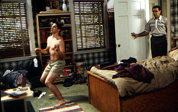 Jason Biggs dances towards manhood without knowing that Eugene Levy is looking on in Universal's American Pie - 1999