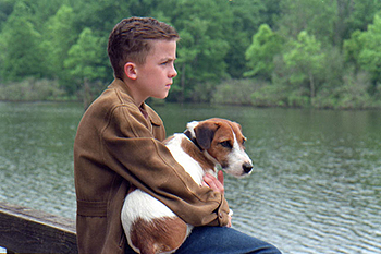 Willie Morris (Frankie Muniz) and his dog in Warner Brothers' My Dog Skip (12/99)