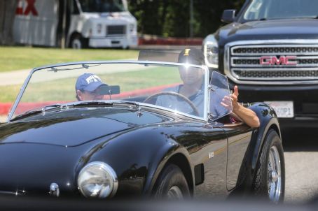 Mila Kunis – Out in Los Angeles riding his classic ford convertible