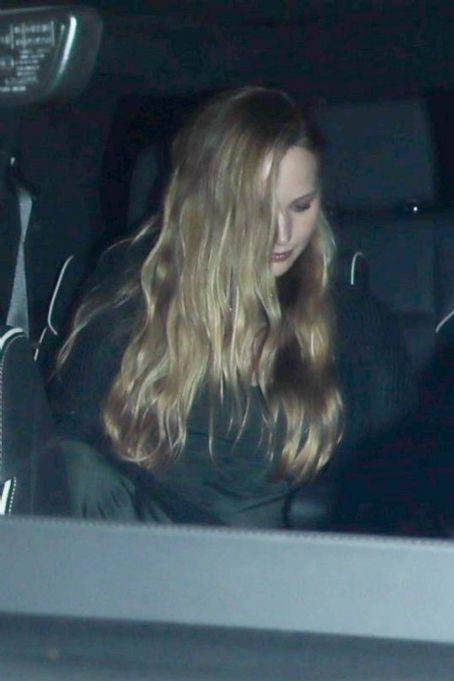 Jennifer Lawrence – In a dark dress arrives at Giorgio Baldi in Santa