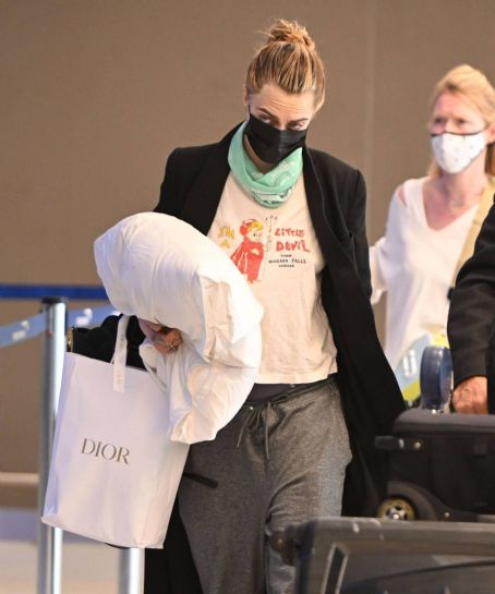 Cara Delevingne – Catches a flight out of JFK Airport in New York