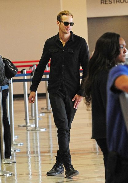 Alexander Skarsgard seen dressed all in black while catching a flight at the LAX Los Angeles Airport