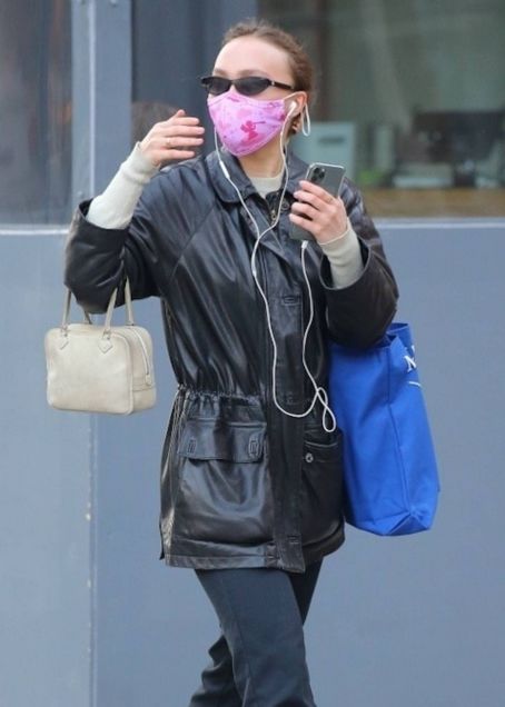 lily-rose depp steps out in a black leather jacket, brown knee high boots  and louis vuitton purse during a shopping trip in new york city-100219_4