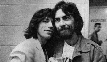 George Harrison and Mick Jagger backstage at a Rolling Stones concert at the Los Angeles Forum on July 10, 1975