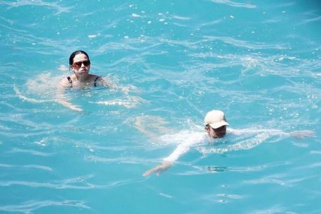 Katy Perry – Spotted in a black swimsuit while on vacation on Positano