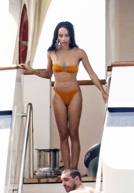 Zoe Kravitz Spotted in orange bikini aboard a yacht in Positano