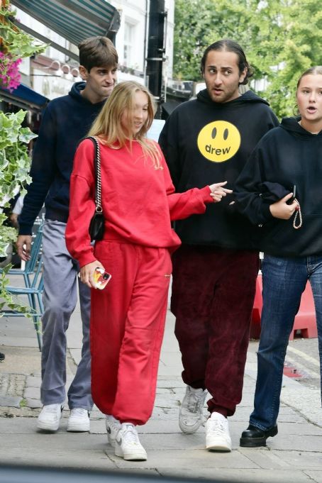 Lila Grace Moss Wears A Bright Red Tracksuit While Out With Friends