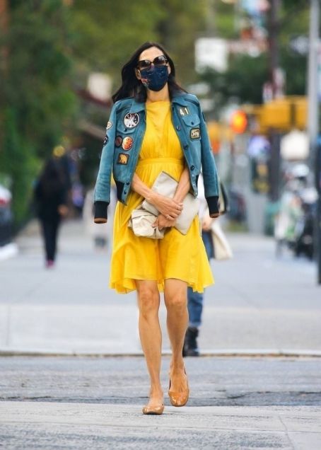 Famke Janssen – In a yellow dress and denim jacket out New York